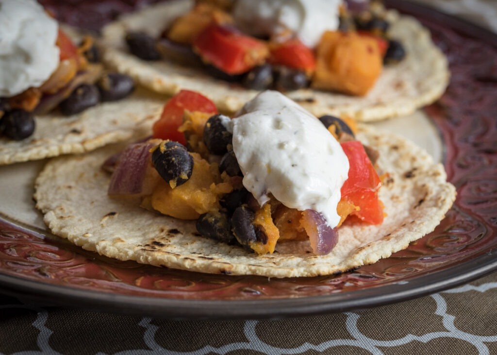 Spicy Sweet Potato & Black Bean Tacos with Garlic Yogurt Sauce